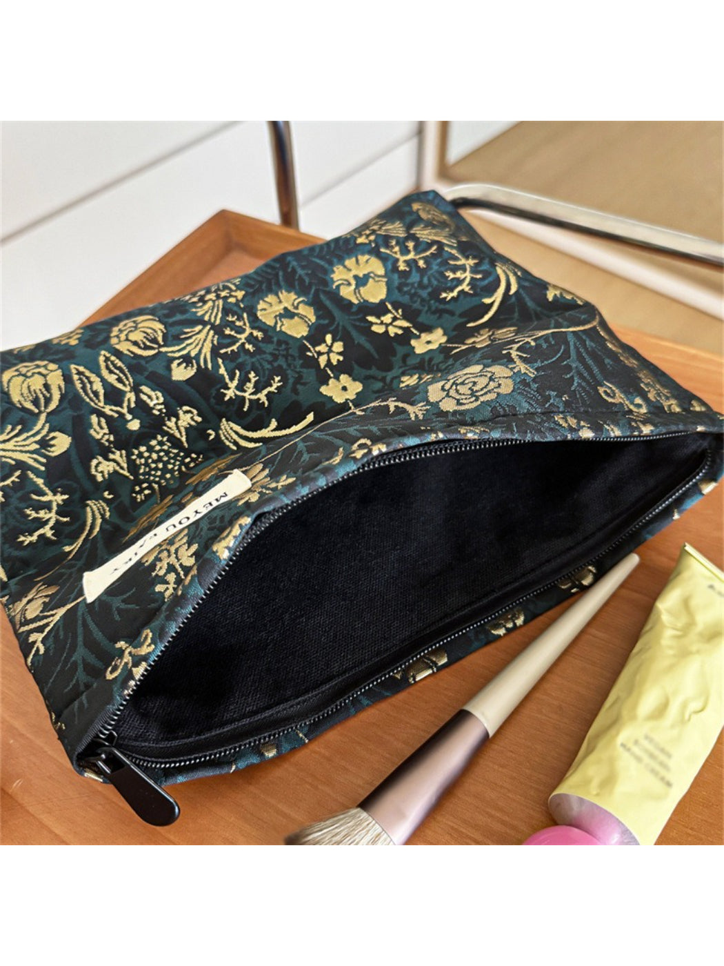 Cosbai dark floral cosmetic bag standing upright on a white surface