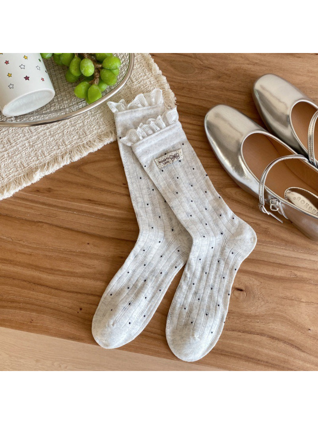 Side view of ribbed polka dot socks showing heel and toe details