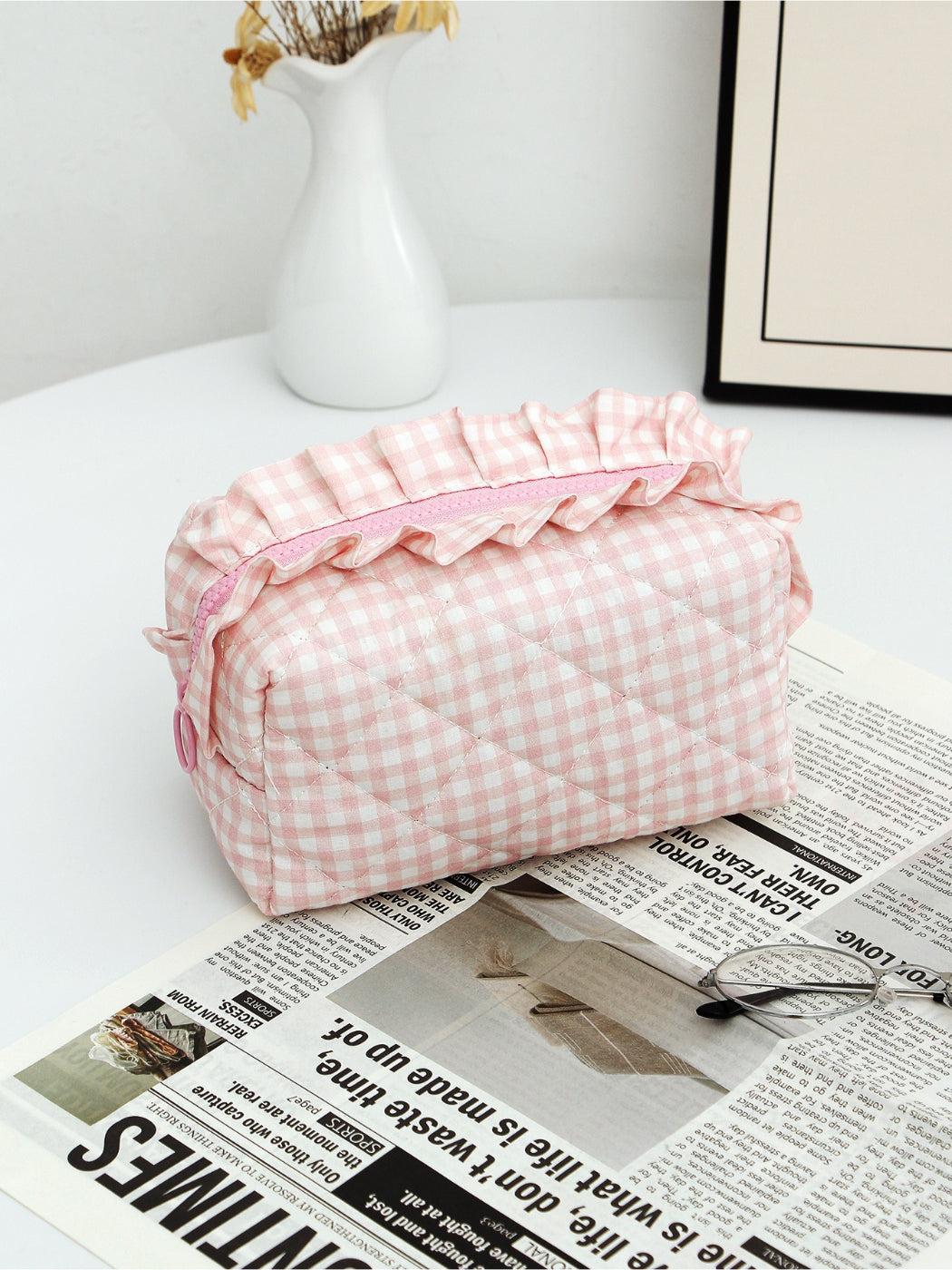 Close-up of Cosbai checkered makeup pouch showing ruffle trim detail