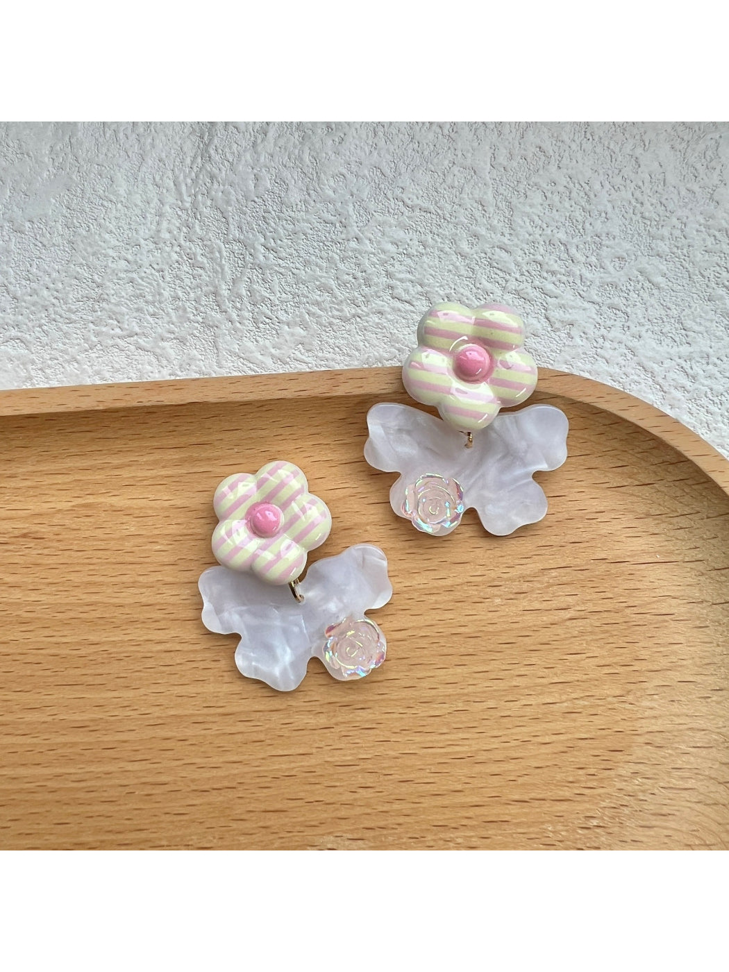 Earwish Stripe Flower Bow Earrings displayed on a white background