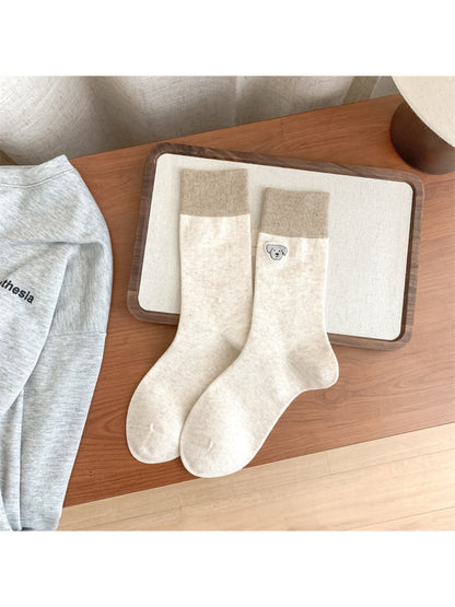Rufia soft crew socks folded neatly with animal face embroidery visible