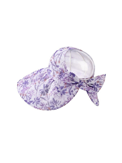 Side view of pastel bloom wide brim hat showing curved brim and floral design