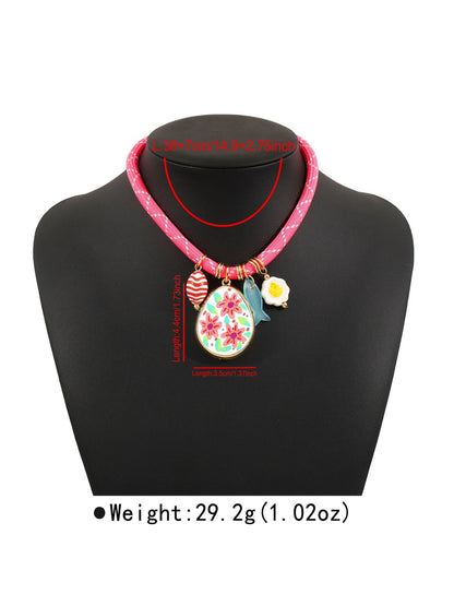 Multi charm rope necklace displayed flat showing full length and vibrant colours