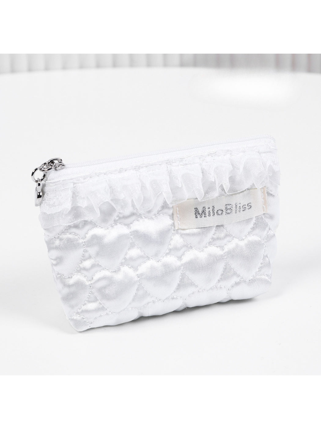 Side view of Cosbai Quilted Heart Cosmetic Pouch highlighting its shape and quilting