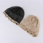 Close-up of Haila beanie showing detailed hollow out knit mesh shell pattern
