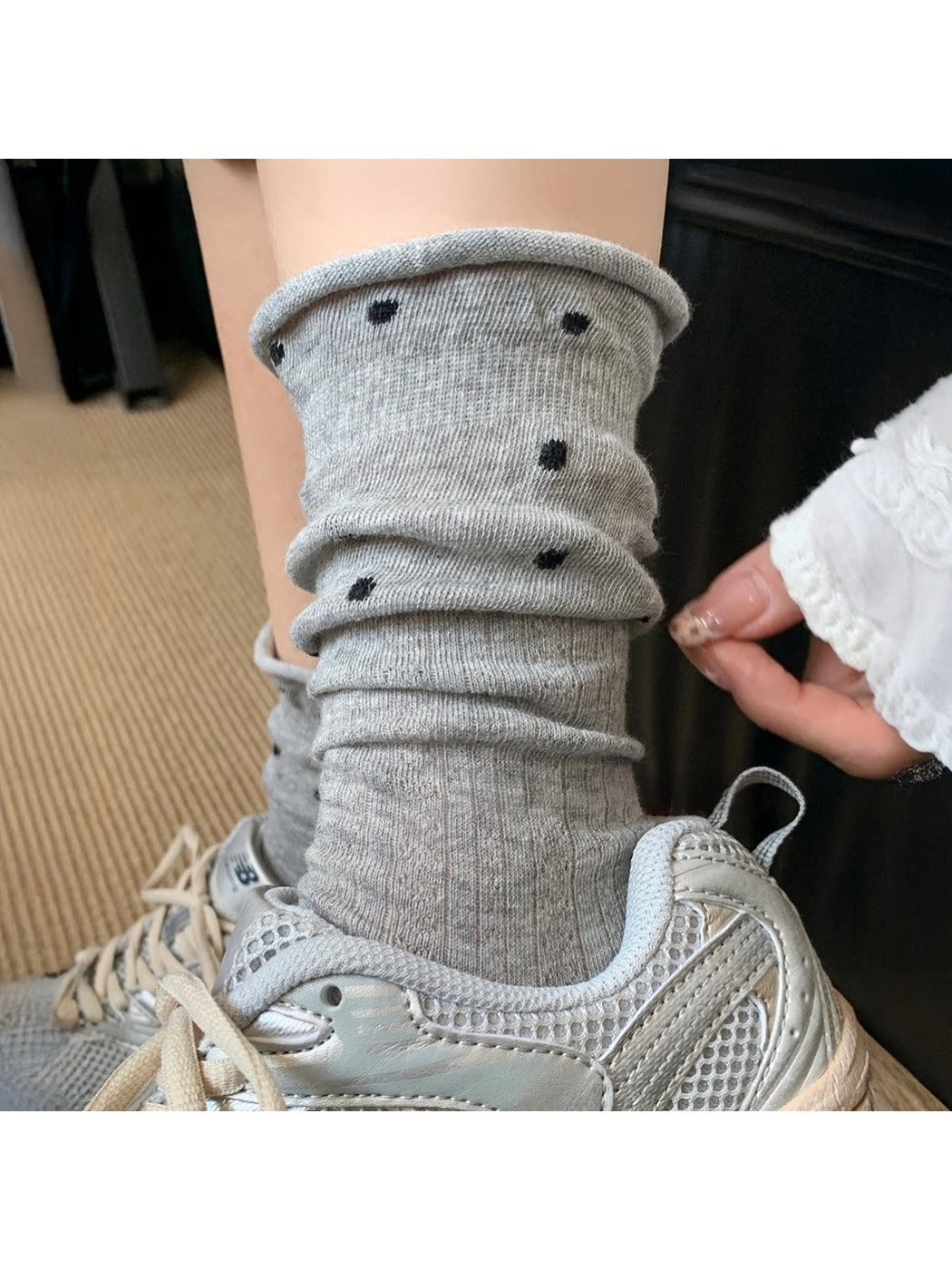 Close-up of Rufia socks ruffle trim and mesh dot fabric texture