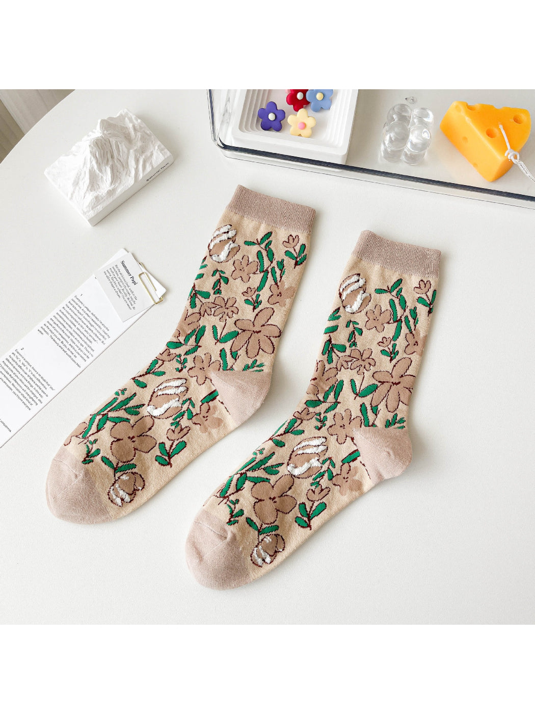 Model wearing Rufia Woodland Bloom crew socks paired with casual shoes