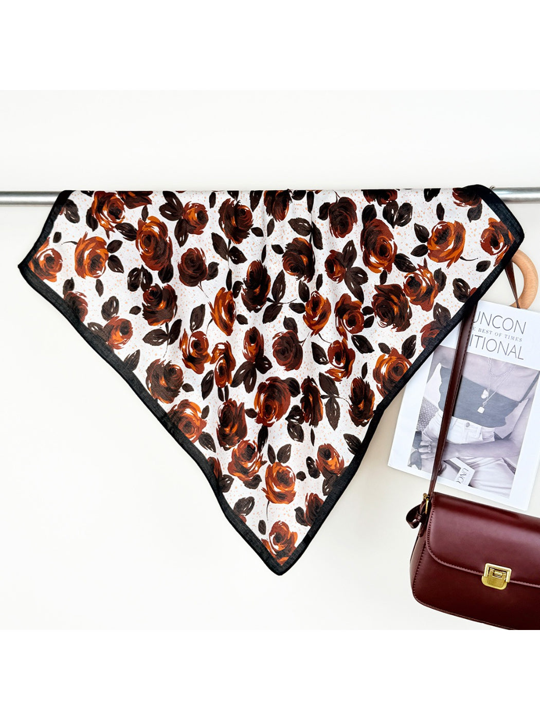 Scarvii rose print scarf draped over a chair