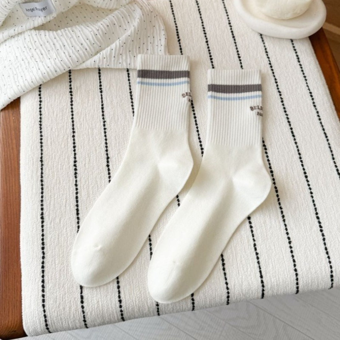 Rufia Retro Stripe Letter Crew Socks folded to show the stripe pattern and letter accents