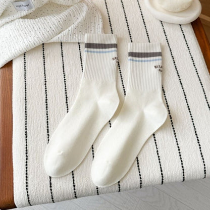 Rufia Retro Stripe Letter Crew Socks folded to show the stripe pattern and letter accents