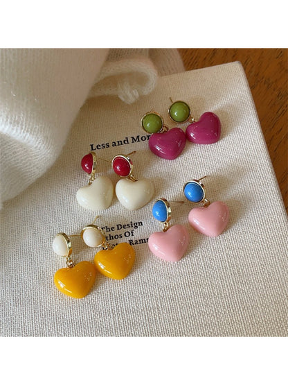 Close-up of Earwish Color Pop Heart Drop Earrings in vibrant red and pink colors