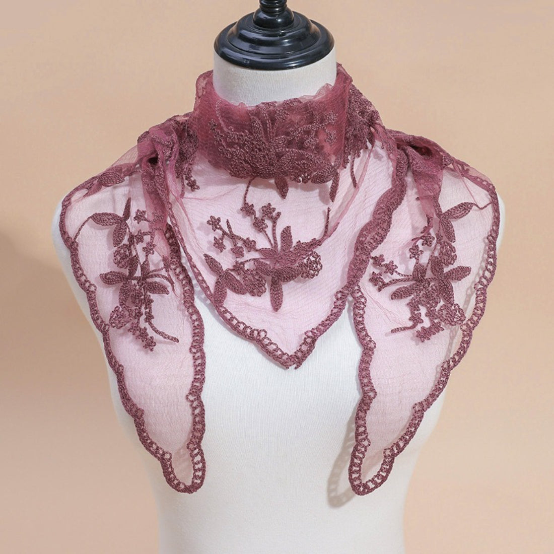 Side view of model with Haila lace veil head scarf draped over shoulders