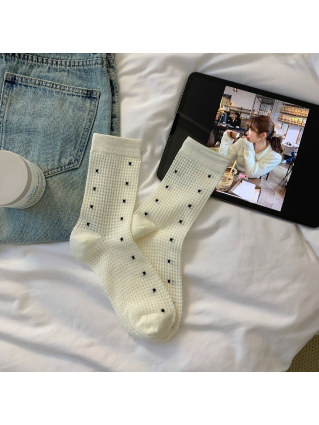 Side view of Rufia beige waffle dot crew sock on a white background