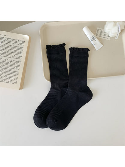 Rufia Everyday Ruffle Cuff Crew Socks worn with casual shoes and rolled-up jeans