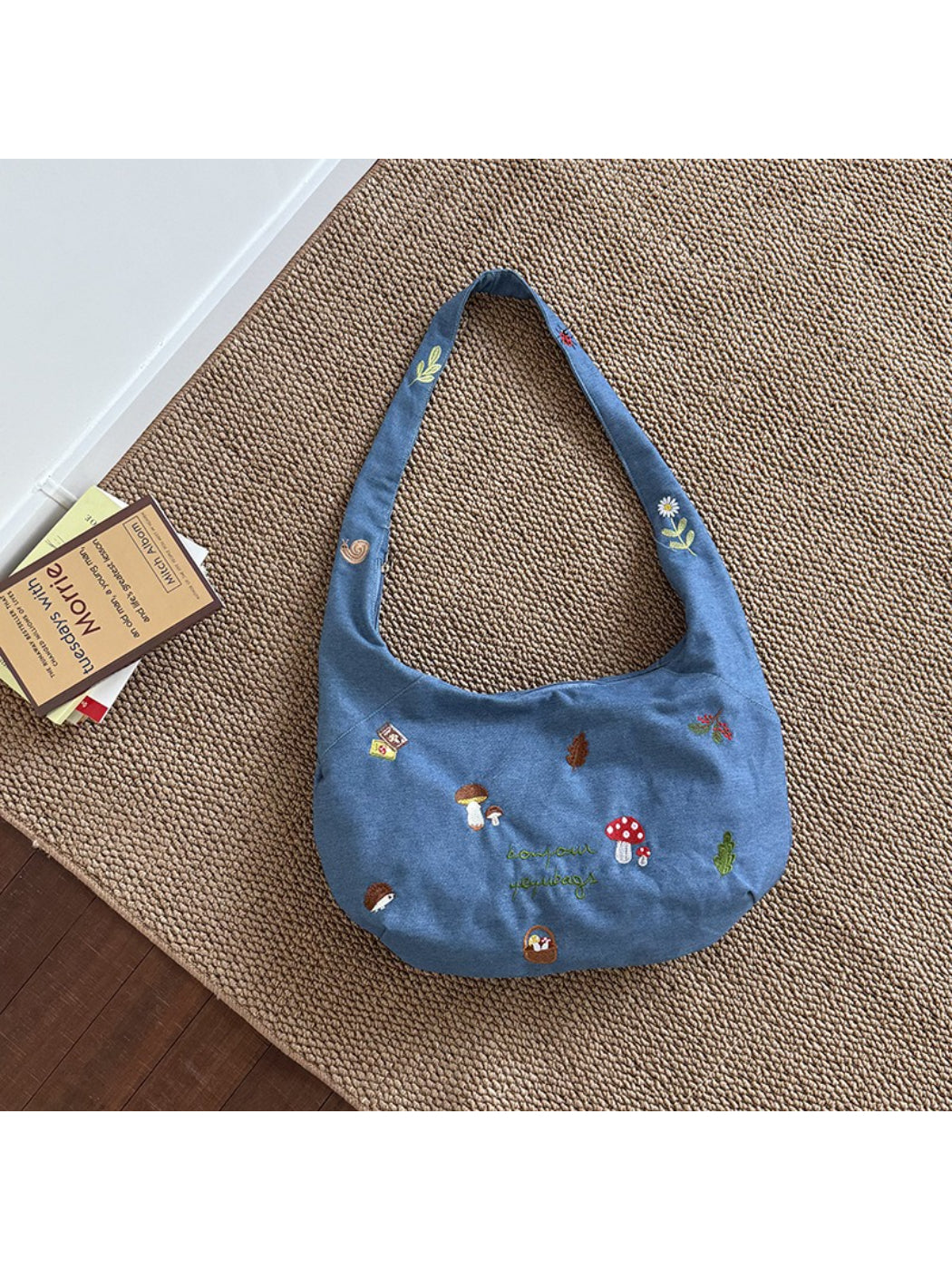 Cosbai shoulder bag open showing interior lining and spacious