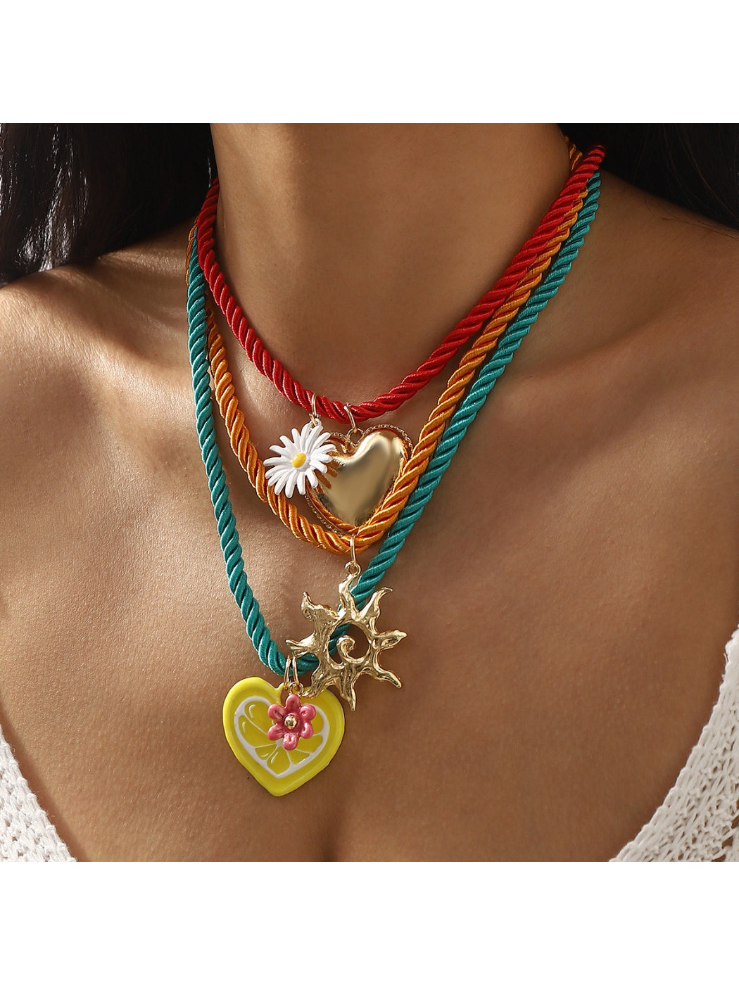 Close-up of Neckit colourful charm rope necklace with multicolored beads on white background