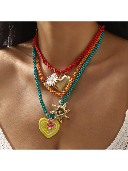 Close-up of Neckit colourful charm rope necklace with multicolored beads on white background