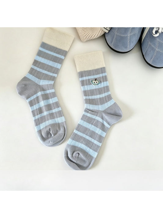 Close-up of Rufia mid-calf socks showing detailed embroidered lace mesh pattern