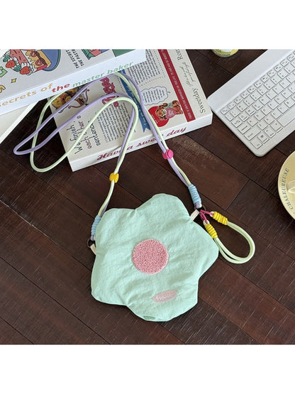 Cosbai floral mini crossbody coin pouch worn crossbody on a model