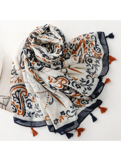 Side view of scarf with tassels hanging, emphasizing fabric texture and design