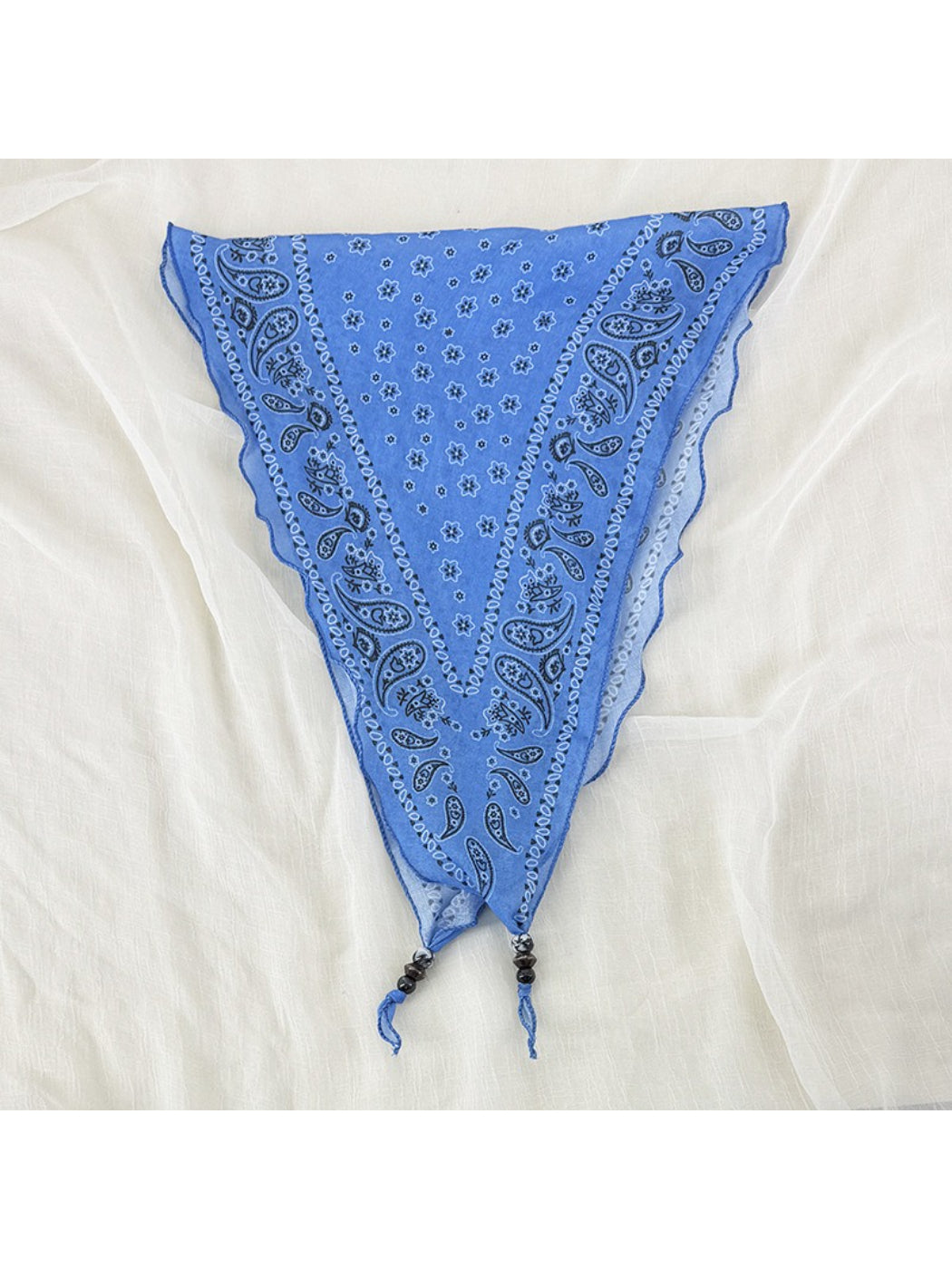 Close-up of fabric pattern on Scarvii vintage bandana headscarf with bead trim
