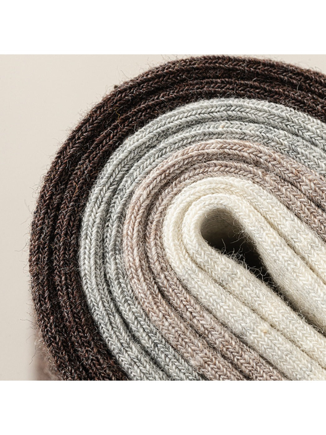 Close-up detail of light gray Rufia ribbed mid-calf sock cuff and ribbing