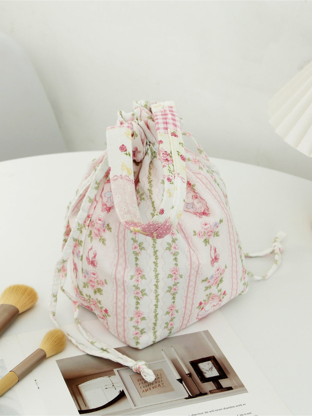 Side view of Cosbai soft floral drawstring handbag highlighting shape and floral print