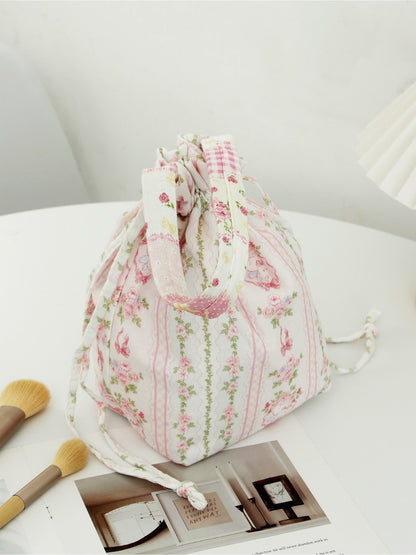 Side view of Cosbai soft floral drawstring handbag highlighting shape and floral print
