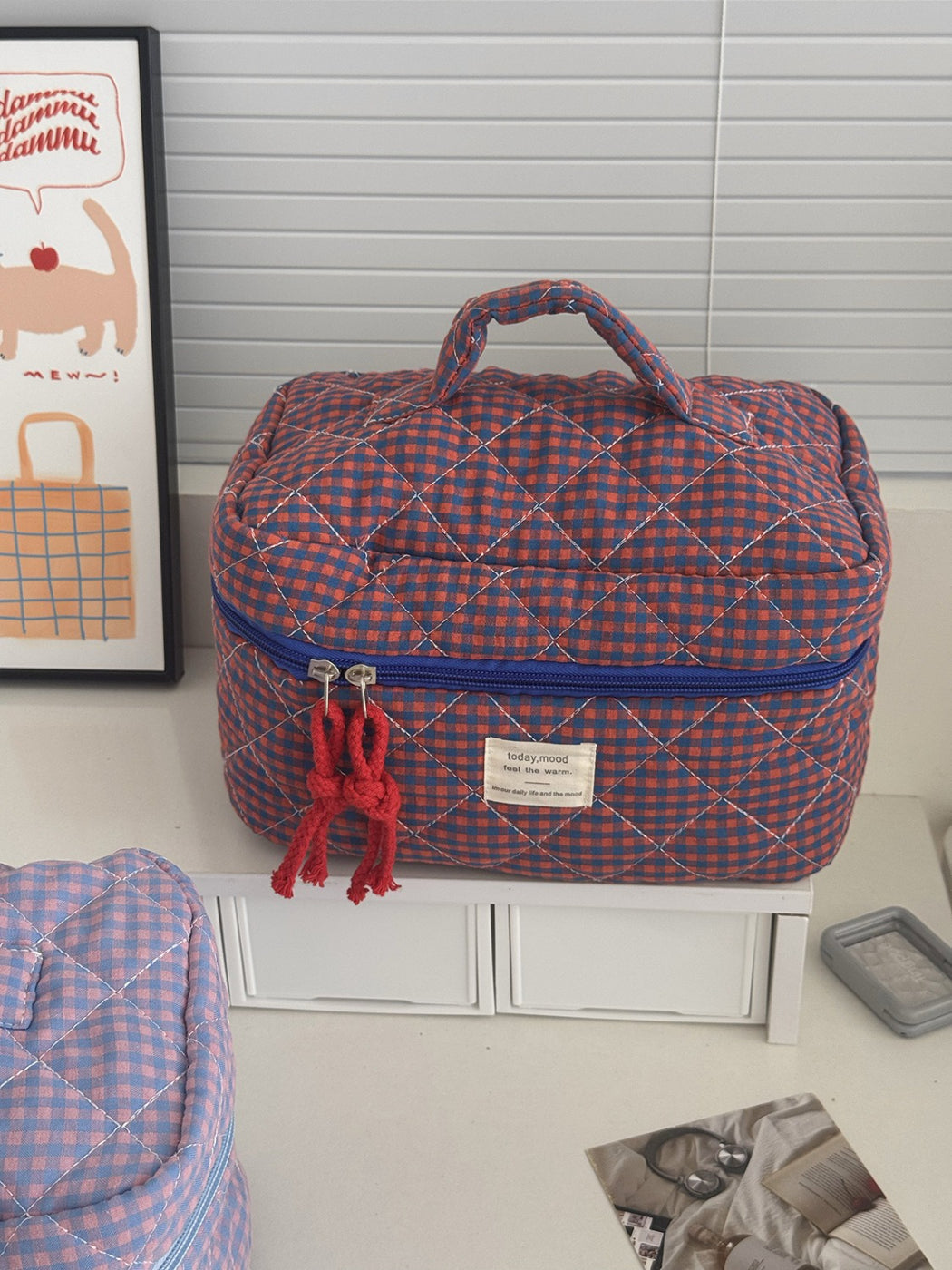 Cosbai Puffy Check Travel Makeup Bag shown from top angle emphasizing its size and pattern