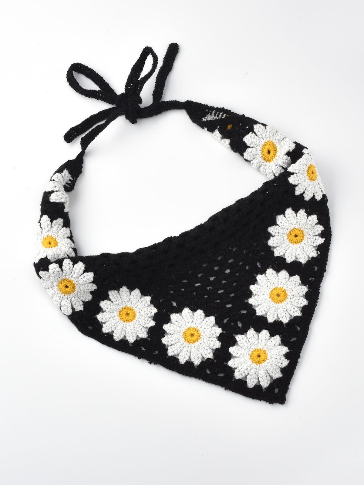 Side view of crochet hairband with sunflower and mushroom embellishments