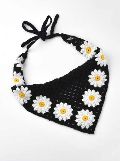 Side view of crochet hairband with sunflower and mushroom embellishments