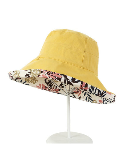 Haila bucket hat folded to display both floral and solid reversible sides
