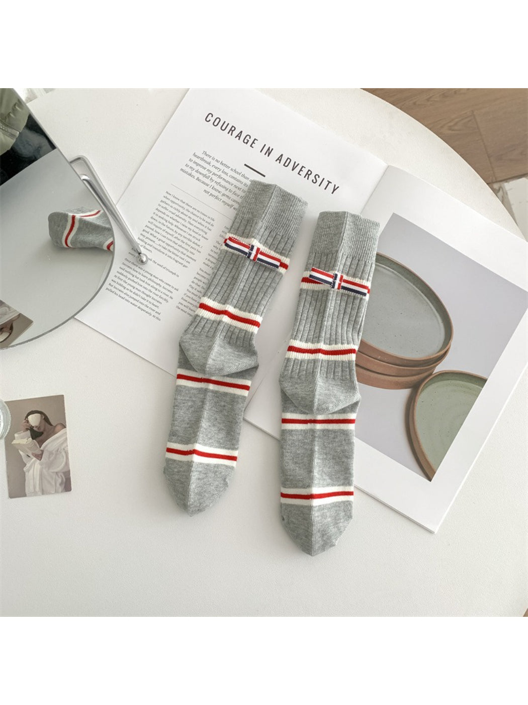 Side view of Rufia preppy crew socks featuring thick red and navy stripes