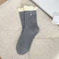 Close-up of soft knit fabric and ribbing on Rufia ruffle accent socks