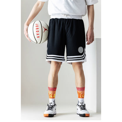 Model wearing Rufia color block sport crew socks with casual sneakers