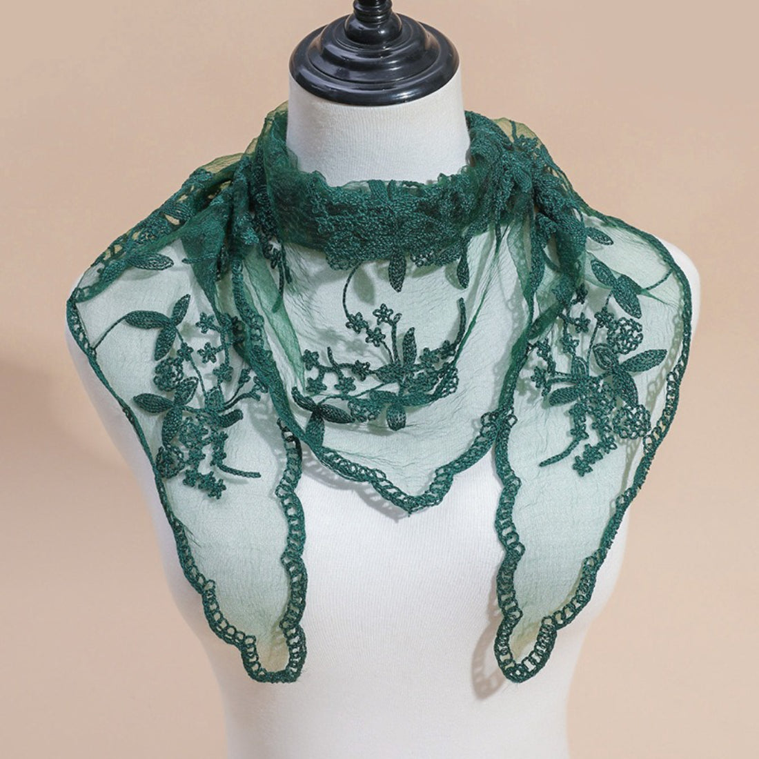 Detailed embroidery pattern on Haila lace veil head scarf close-up