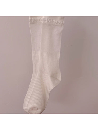 Side view of Rufia beige ribbed crew socks highlighting loop trim