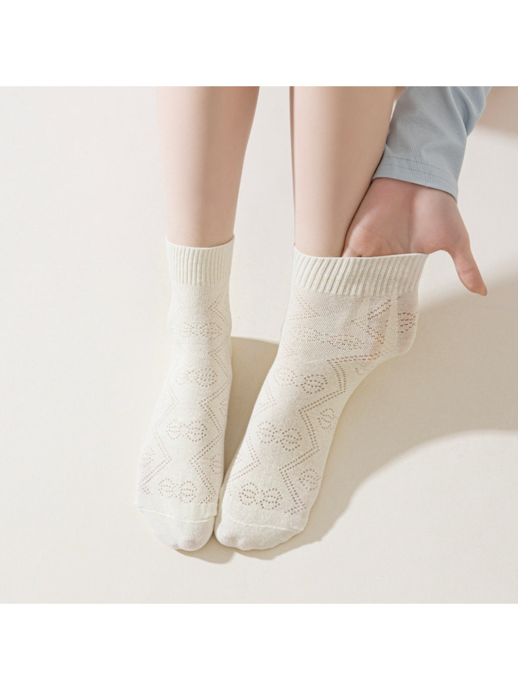 Rufia Pointelle Ribbon Crew Socks worn on feet with visible pointelle knit design