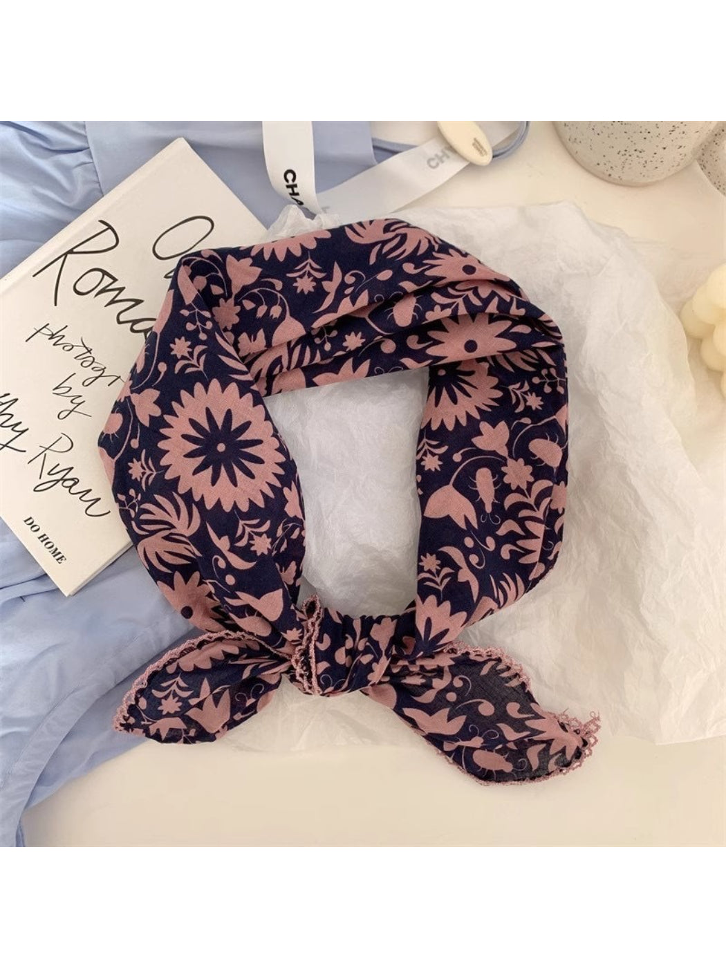 Scarvii scarf folded to highlight corner with detailed botanical elements and rich color palette