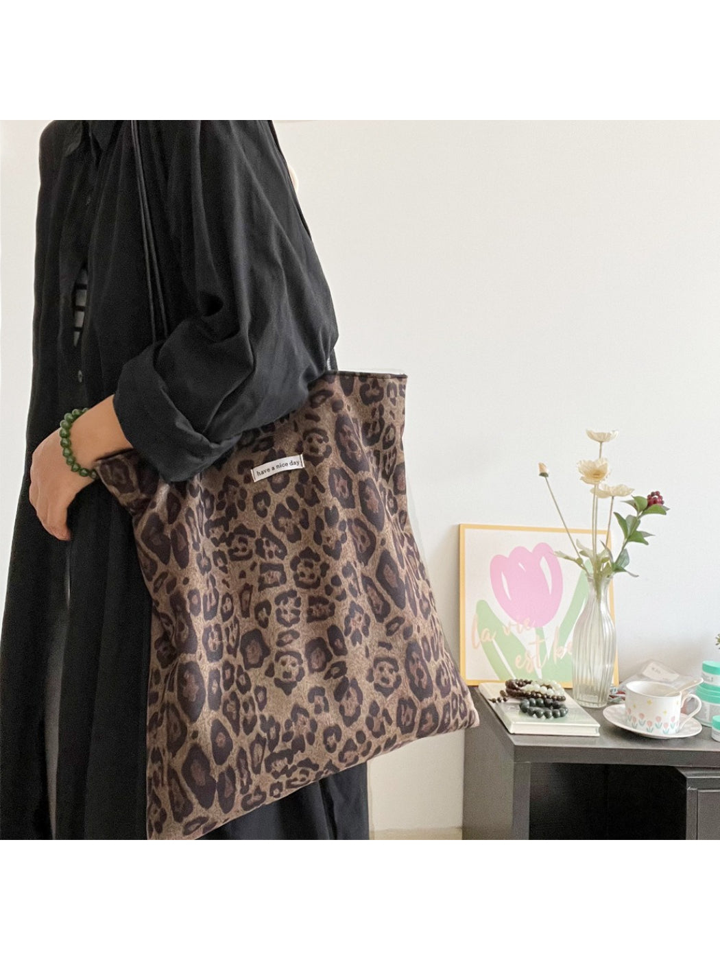 Side view of Cosbai leopard pattern shopper bag highlighting its slim profile
