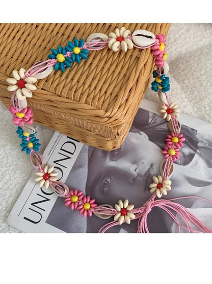 Beco floral shell shaped rope waist belt styled on a mannequin waist