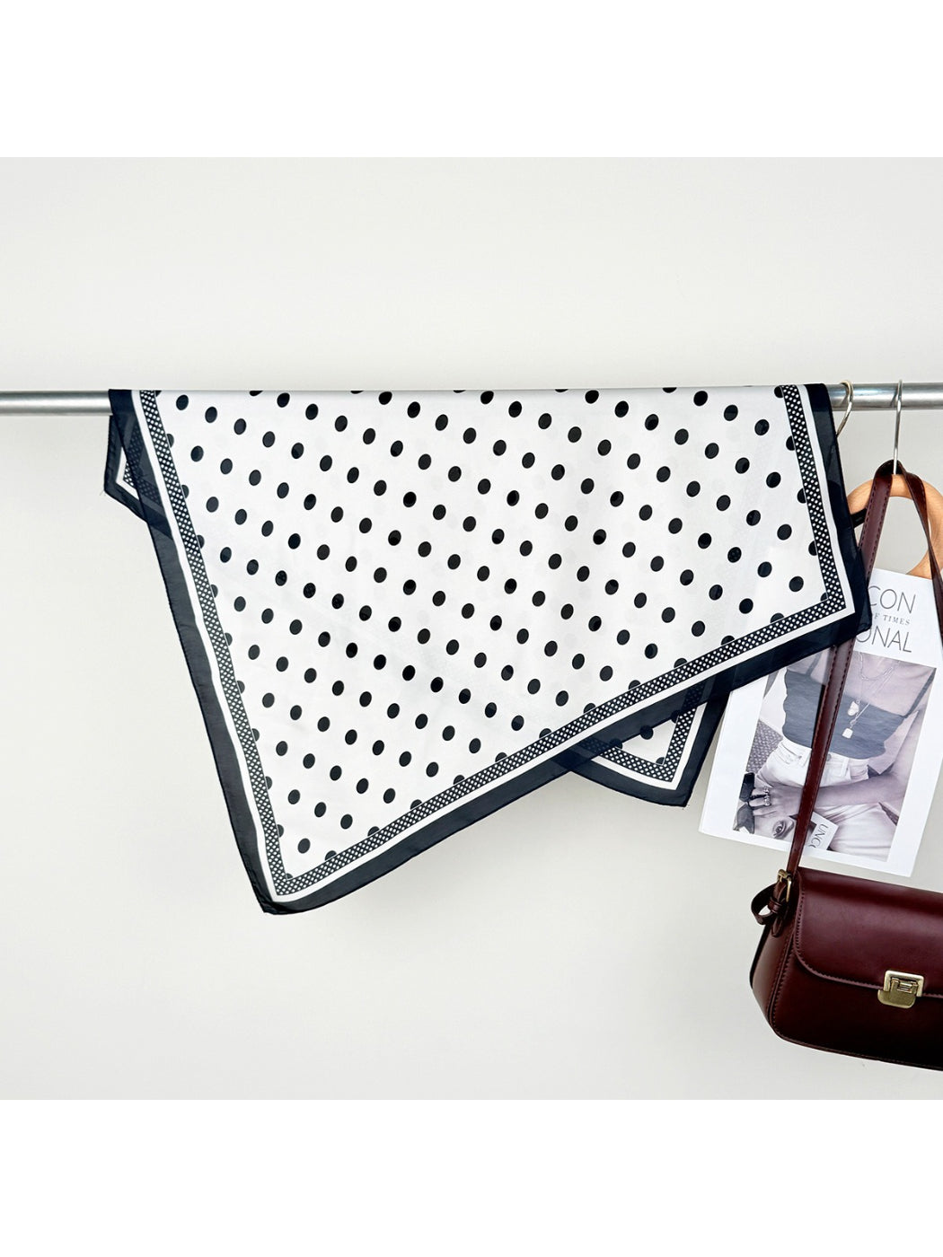 Scarvii contrast polka dot scarf neatly rolled with visible pattern edges