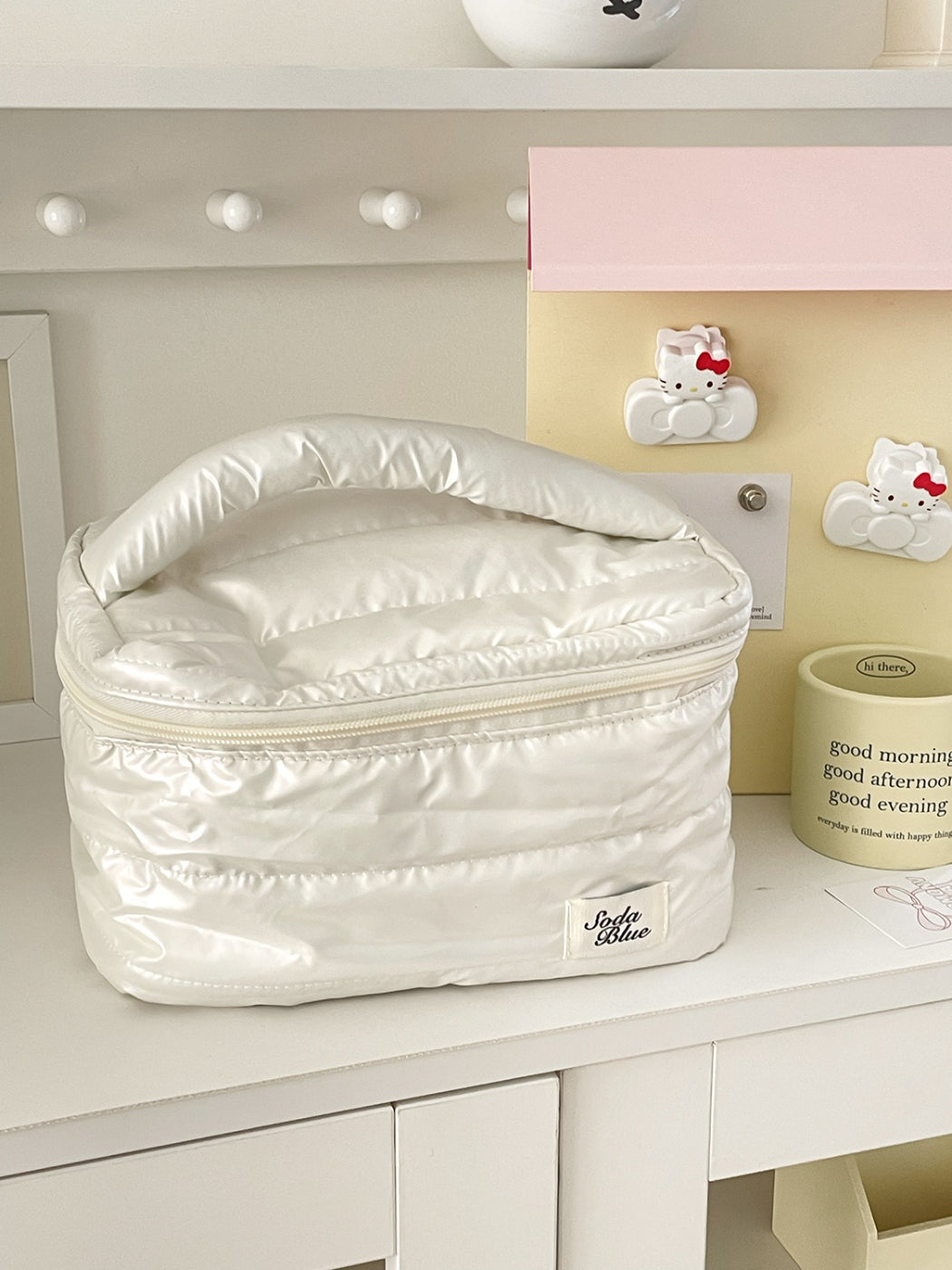 Cosbai quilted makeup bag folded flat for easy storage