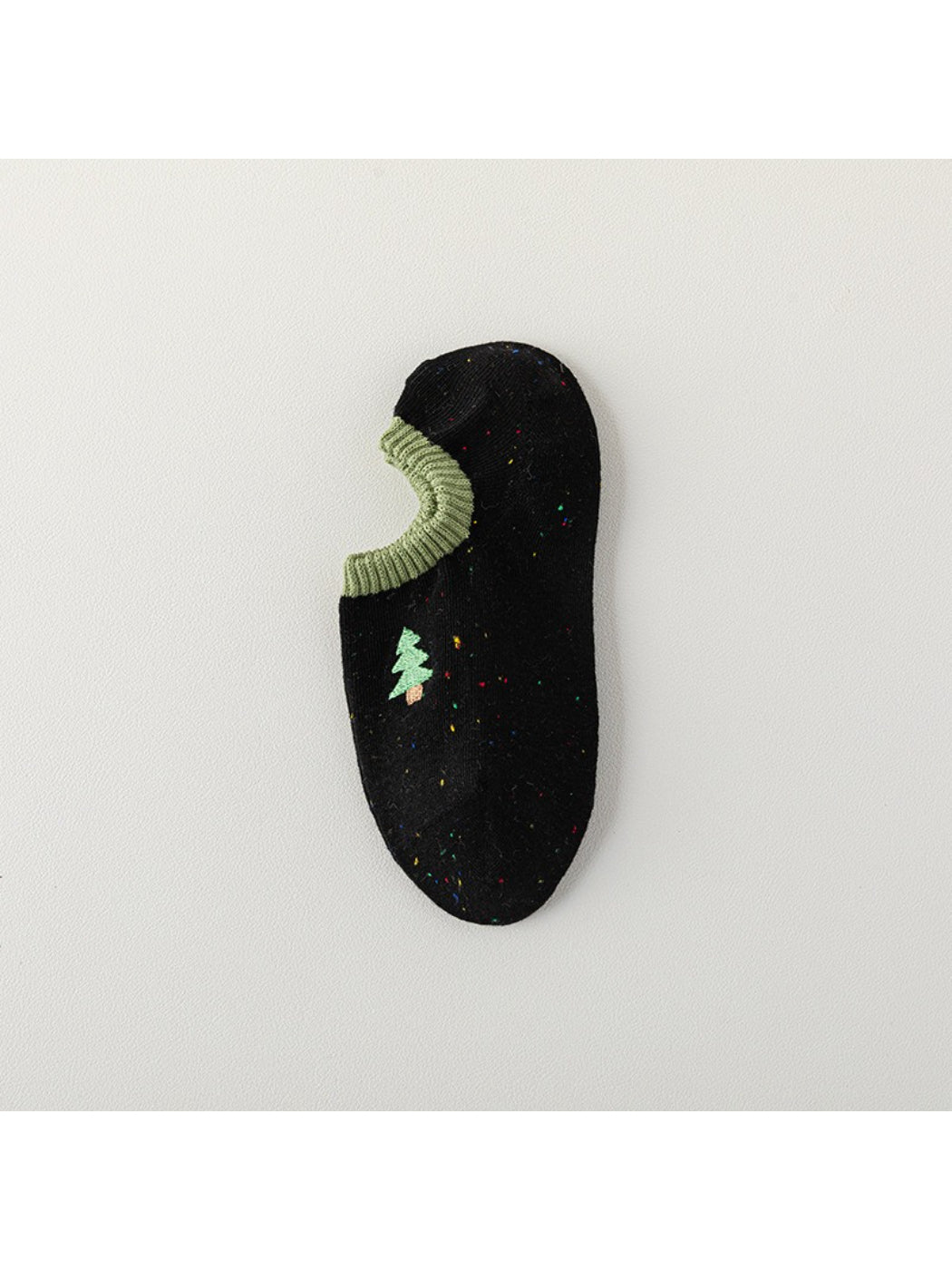 Close-up detail of embroidered dots on Rufia no show socks