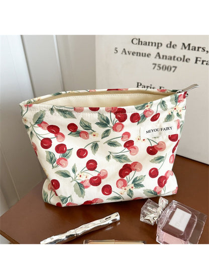 Close-up of the and cherry pattern on the Cosbai Sweet Cherry Makeup Pouch