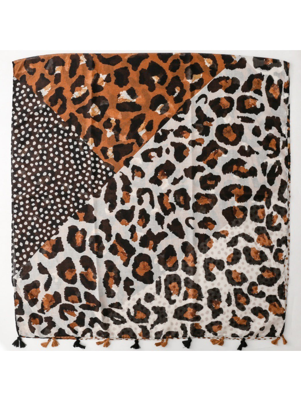 Close-up of leopard print fabric texture and fringe detail on wrap