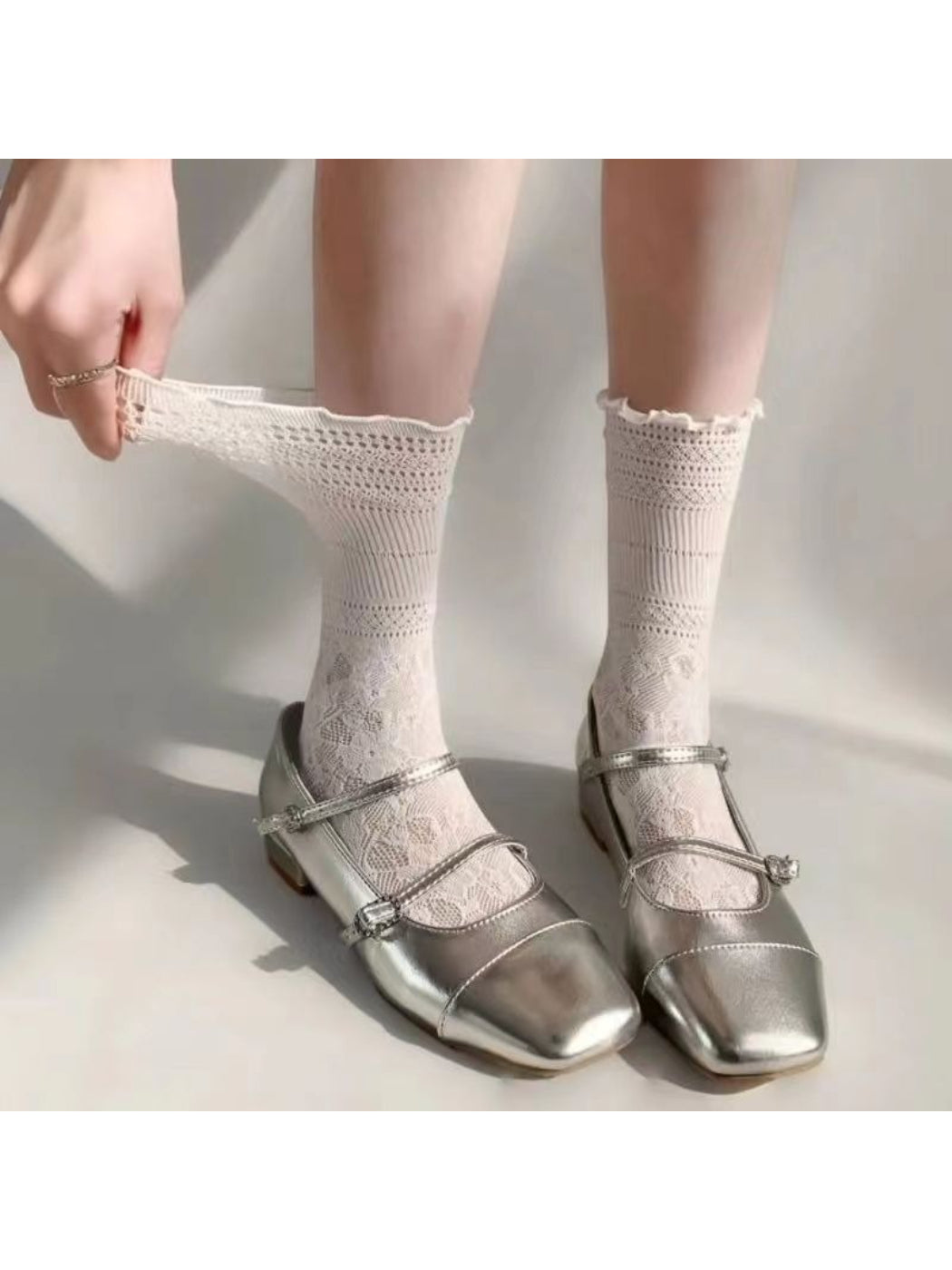 Close-up of Rufia Sheer Heart Pattern Crew Socks fabric texture and heart pattern