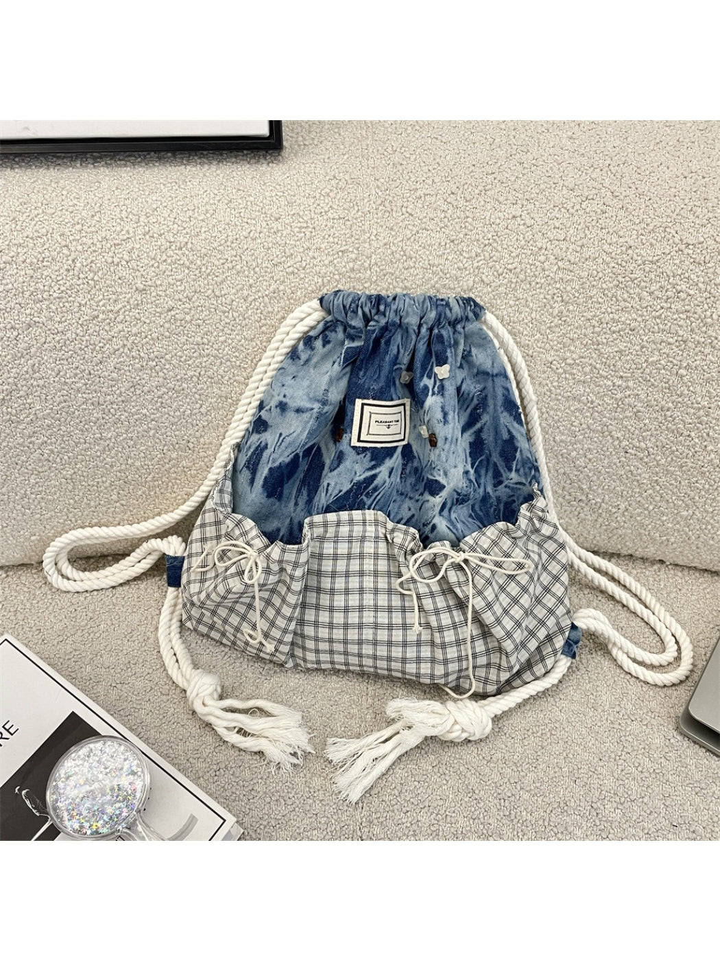 Side view of Cosbai casual drawstring backpack showing strap