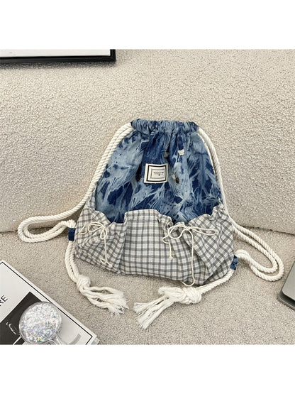 Side view of Cosbai casual drawstring backpack showing strap
