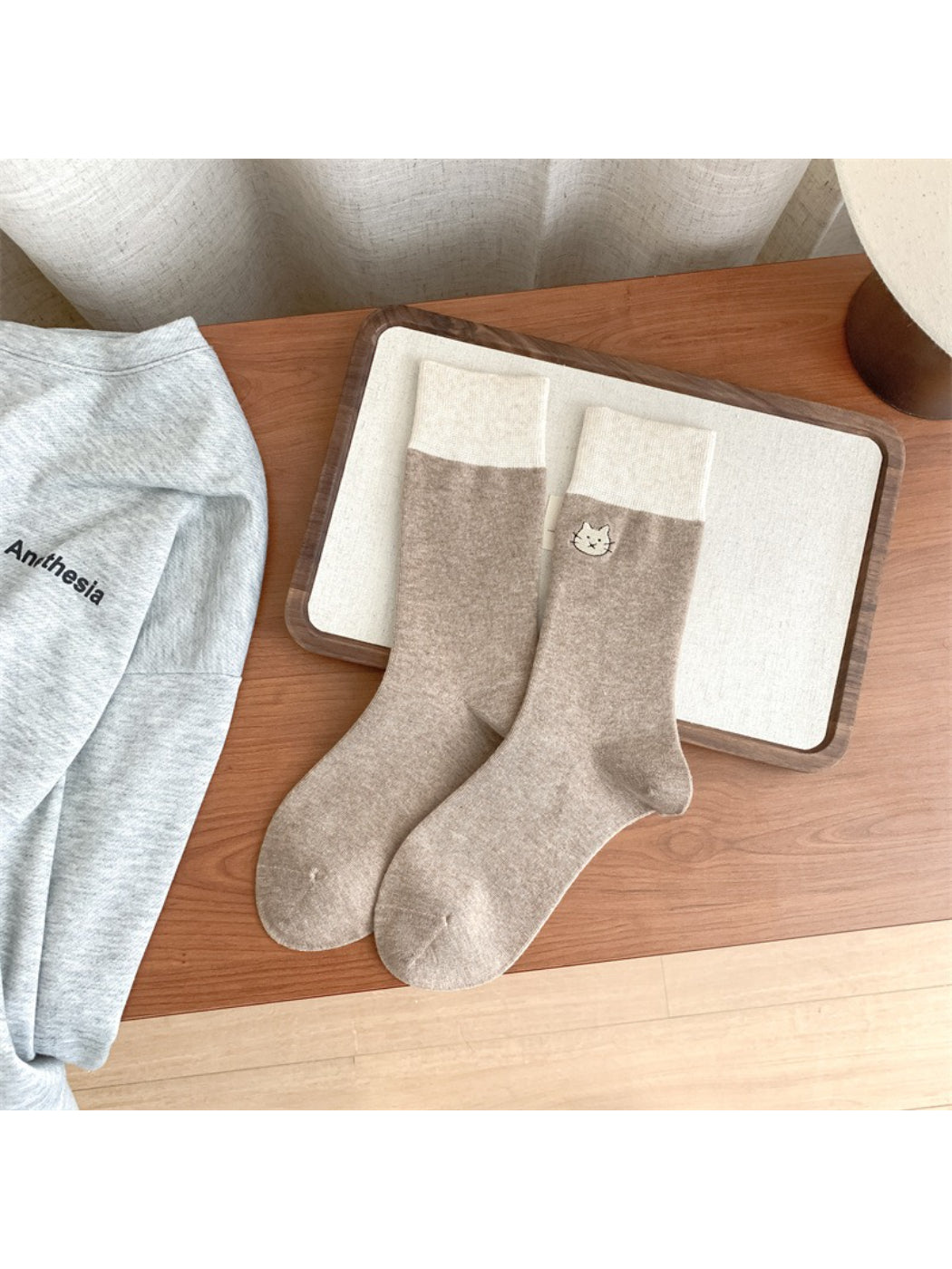 Rufia soft crew socks packaged with label showing cute animal detail and brand name